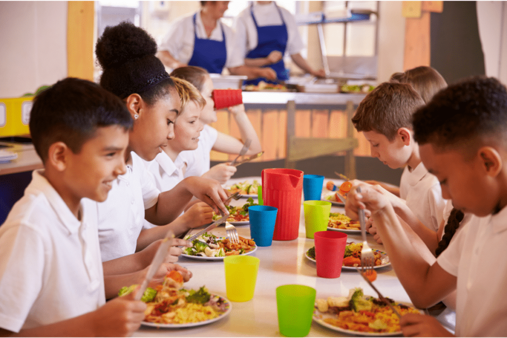 students eating in school cafeteria