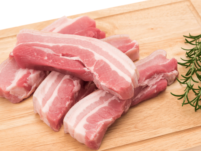 raw pork sitting on a cutting board