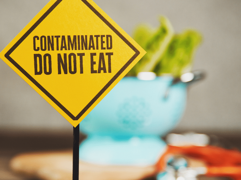 contaminated food with warning sign