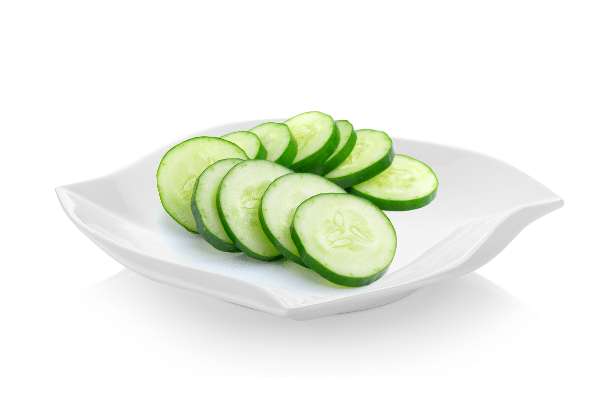 sliced cucumber in a white ceramic plate