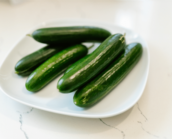 5 whole cucumber in a white ceramic plate